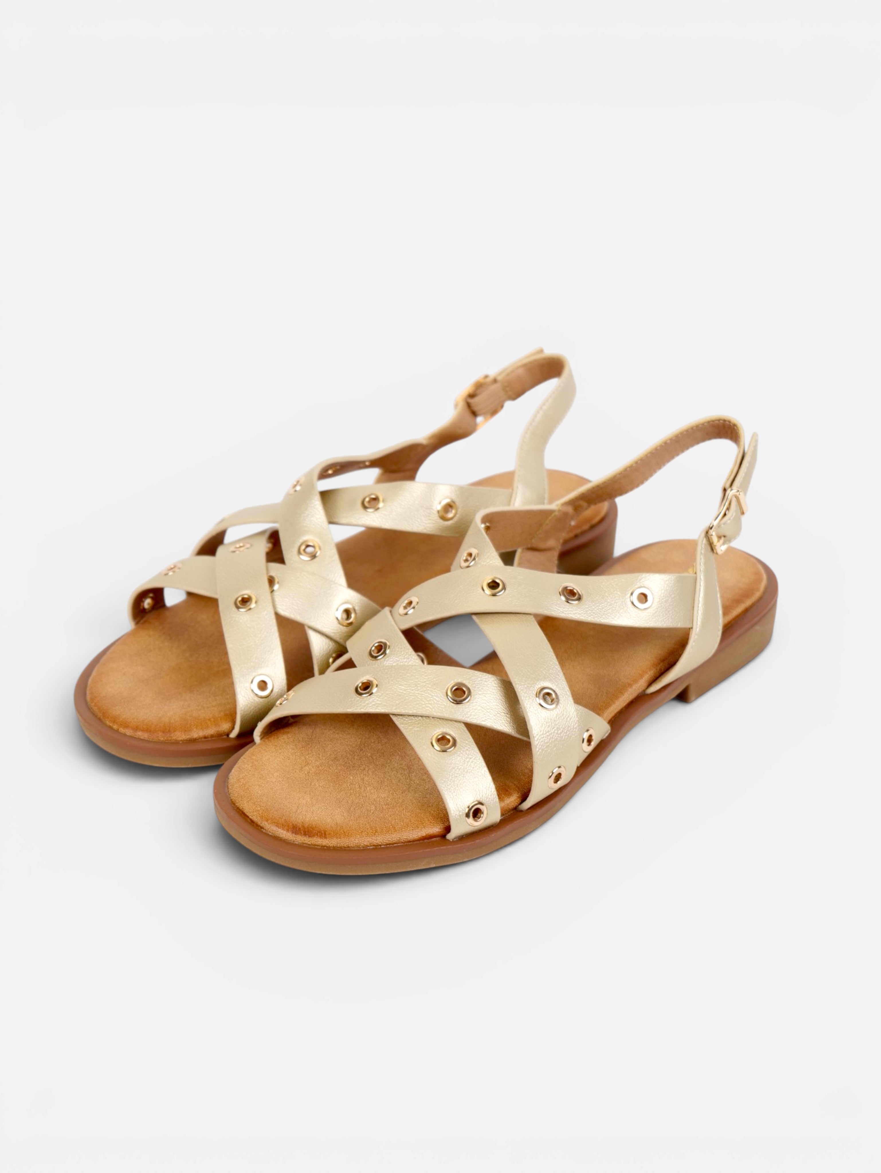 Sandalias romanas planas para mujer con tiras cruzadas, tachuelas doradas y pulsera ajustable al tobillo