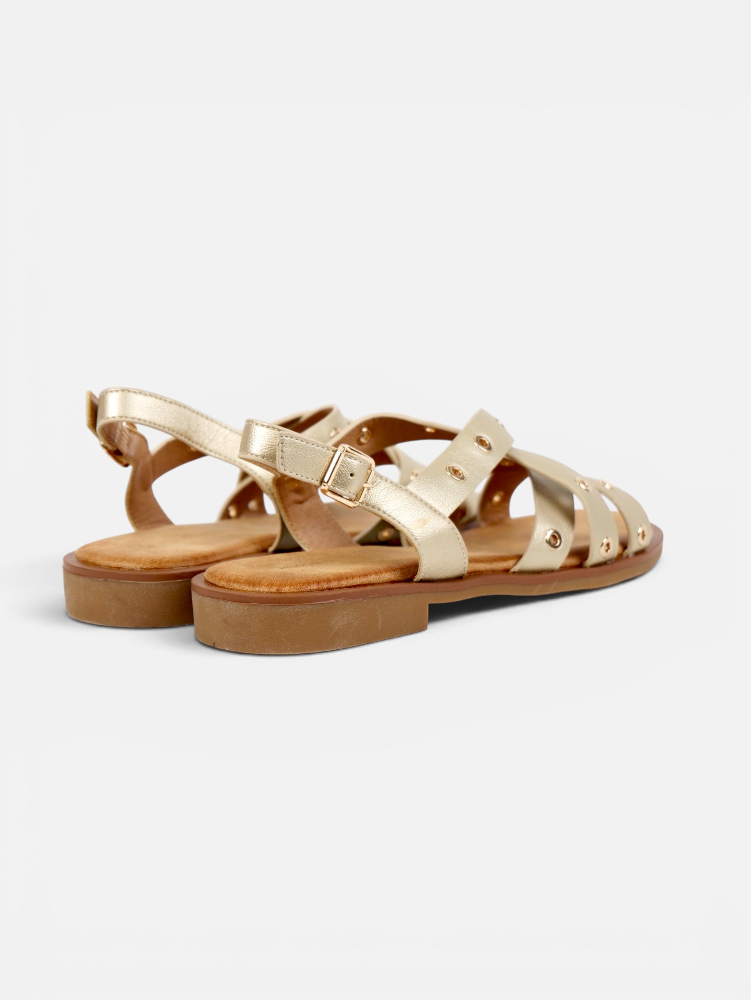 Sandalias romanas planas para mujer con tiras cruzadas, tachuelas doradas y pulsera ajustable al tobillo