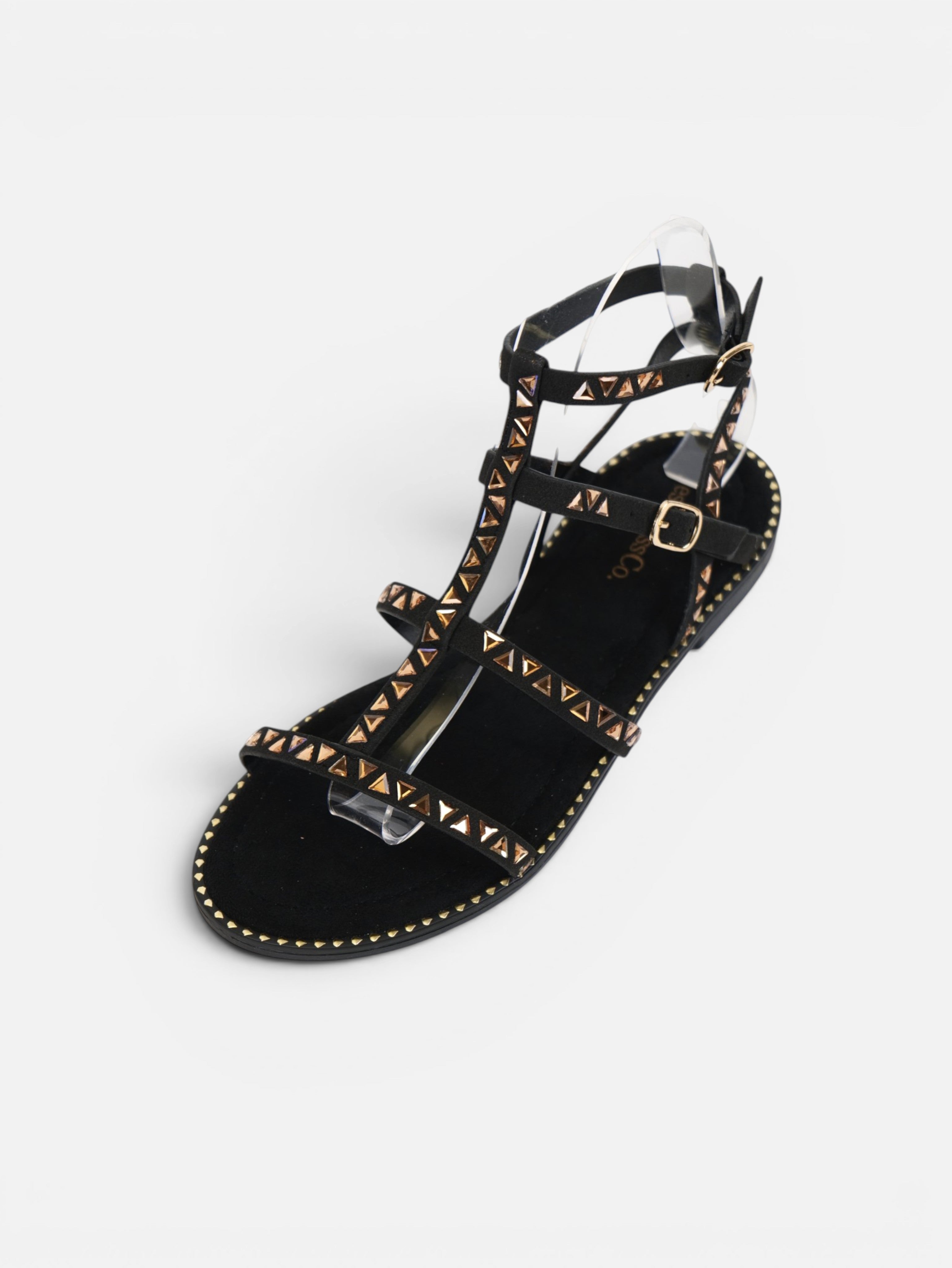 Sandalias romanas planas para mujer con tachuelas doradas, tiras finas y pulsera ajustable al tobillo