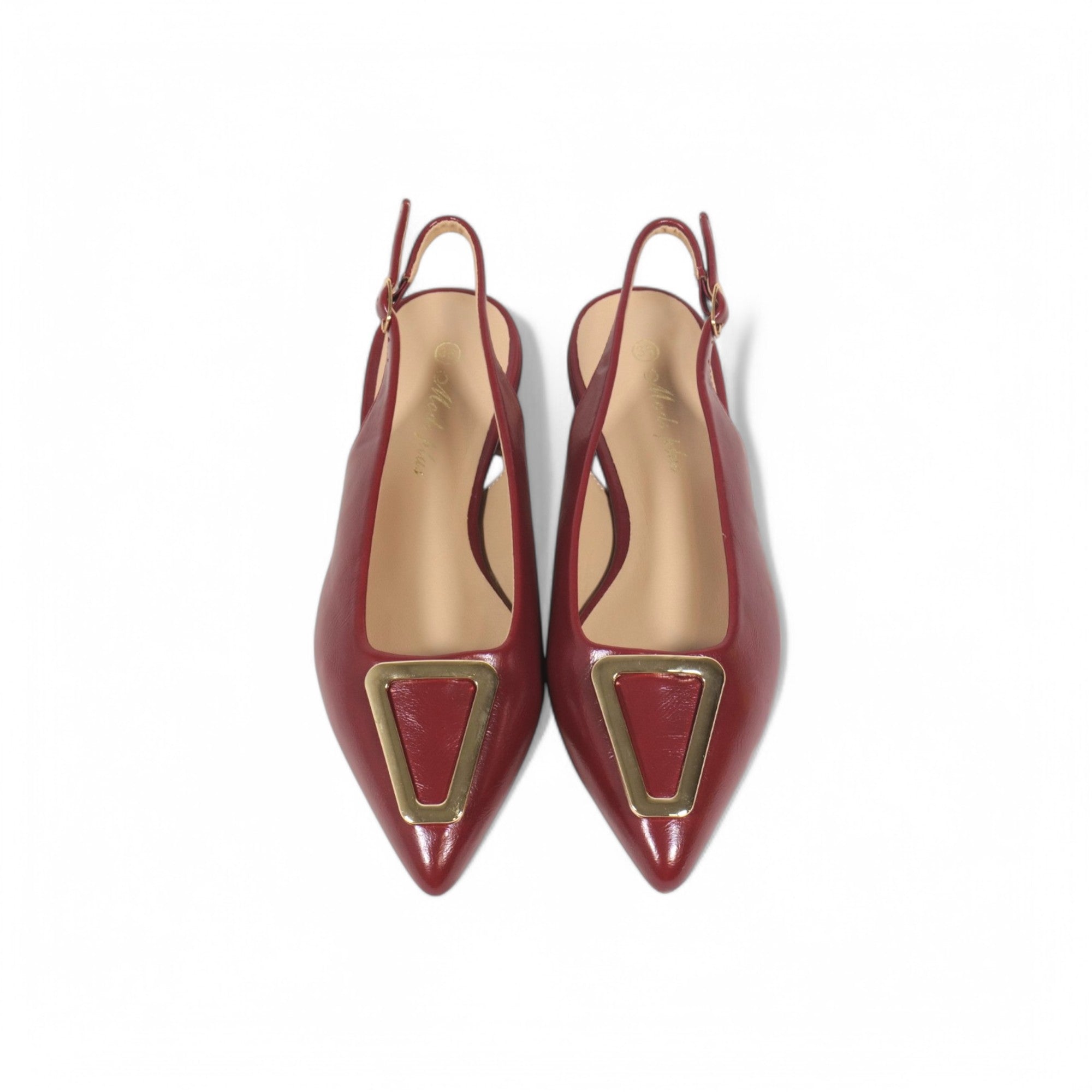 Zapatos planos destalonados con punta fina y adorno triangular